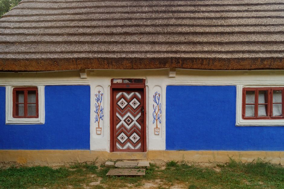 Painted blue exterior wall of a small building